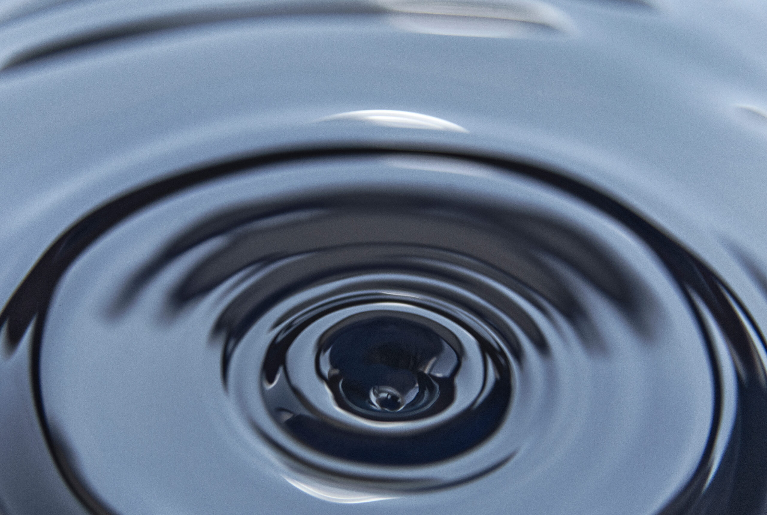 Splash on the black petroleum surface